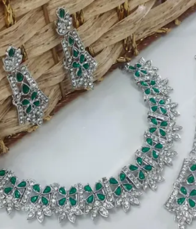 Rhodium Plated Necklace Set With Green Color Kundan